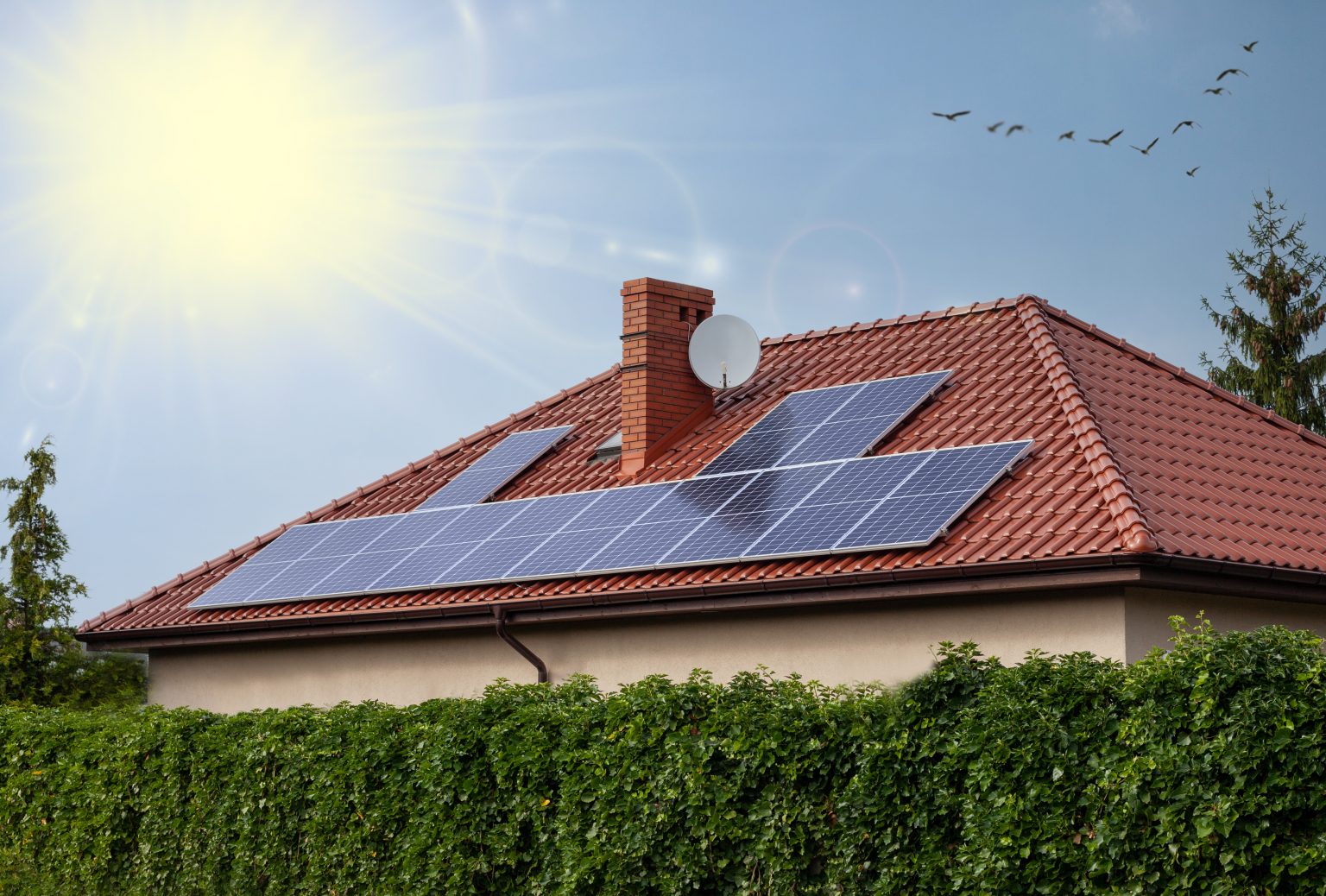 Renewable clean green energy saving efficient photovoltaic solar panels on house roof over blue sky. Renewable clean green energy saving efficient photovoltaic solar panels on house roof over blue sky.